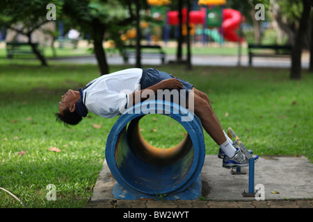 A local man exercising in Lumphini Park or Lumpini Park in central Bangkok, Thailand. Stock Photo