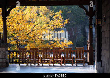 Row of rocking chairs on a resort porch, Mohonk Mountain House, New Paltz, NY, USA Stock Photo