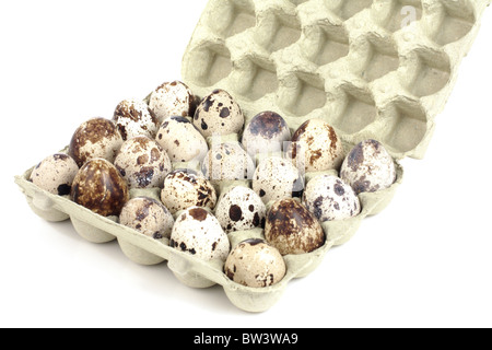 Quail eggs in a box on a white background Stock Photo