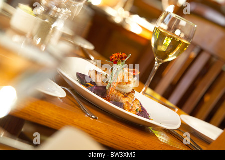 Selective focus, dining room setting, shrimp dinner and wine Stock Photo