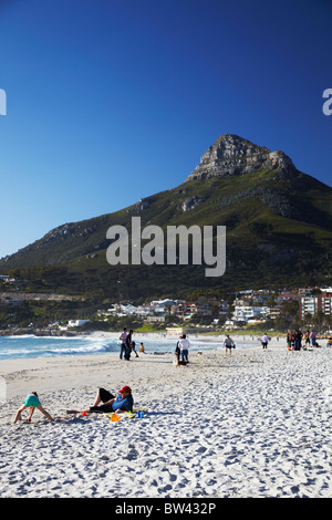 People on Camps Bay beach with Lion's Head in background, Cape Town, Western Cape, South Africa Stock Photo