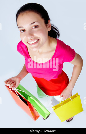 Photo of happy female with colorful shopping bags Stock Photo