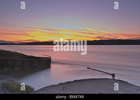 Purton sunset across river Severn and stranded barges Stock Photo