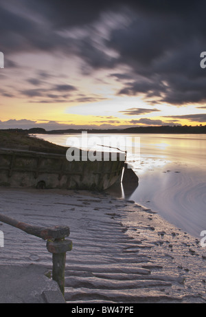 Purton sunset across river Severn and stranded barges Stock Photo