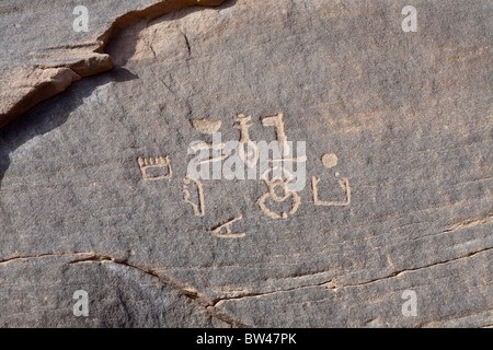 Carved hieroglyphs etched on cliff wall in Wadi Barramiya in the Eastern Desert of Egypt Stock Photo