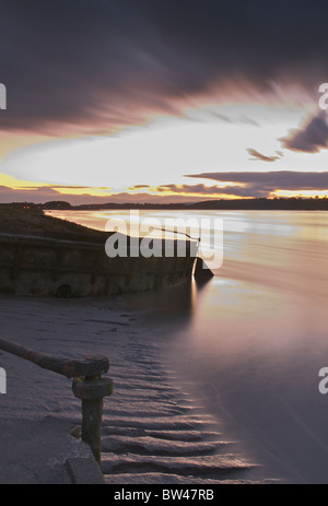 Purton sunset across river Severn and stranded barges Stock Photo