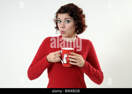 Woman holding a Christmas mug Stock Photo