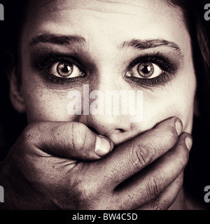 Scared woman victim of domestic torture and violence Stock Photo