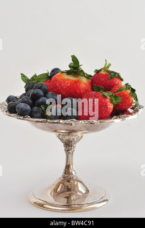 Strawberrys and blueberrys on a silver platter. Stock Photo