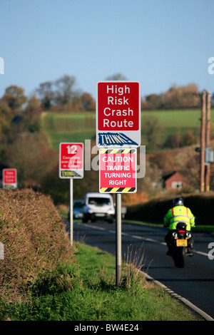 Signs Warning of High Risk Crash Route and Casualty Statistics on the Fosse Way Rural Road, Warwickshire Stock Photo