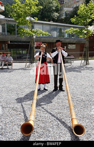 Swiss horn players perform in the twon centre of Wengen, Switzerland Stock Photo