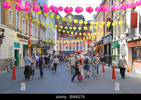 Decorations & colourful Chinese lanterns in Chinatown West End London tourism and shopping scene in Gerrard Street Soho China Town district England UK Stock Photo