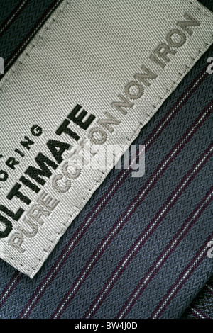 Detail of the label in the collar of a man's striped shirt from Marks and Spencer (M&S) Stock Photo