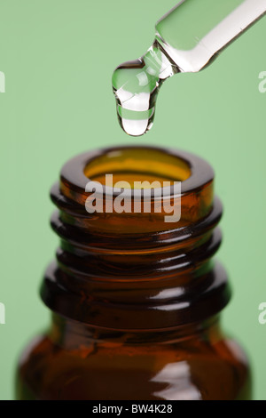 Pipette and bottle of  aromatherapy essence oil Stock Photo