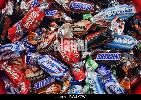 Foil wrapped Celebrations chocolates. Mars, Malteasers, Milky Way, Bounty, Galaxy, Snickers. England, UK, Britain Stock Photo