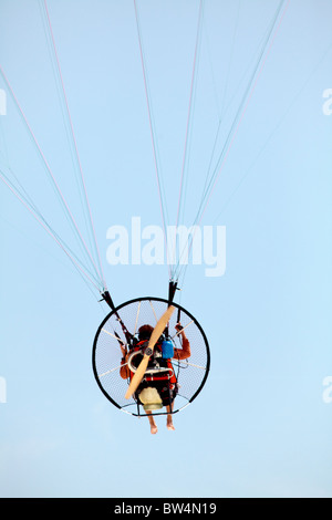 Para glider flying with a para motor. Stock Photo