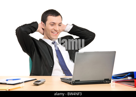 A satisfied businessman looking at his laptop Stock Photo