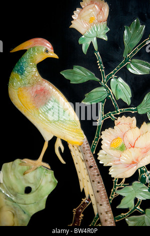 Painted jade carving of a phoenix bird, on a piece of furniture, Beijing, China Stock Photo