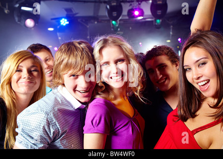 Portrait of happy glamorous friends in a night club Stock Photo
