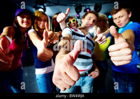 Photo of friends showing thumbs up meaning cool party Stock Photo