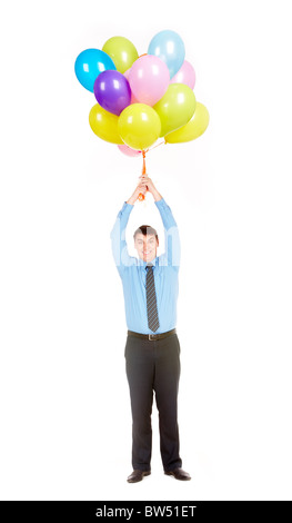 Image of amazed businessman holding bunch of colorful helium balloons against white background Stock Photo