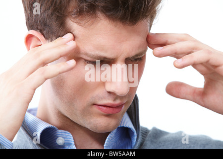 Portrait of young man having headache Stock Photo