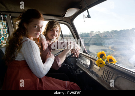Young couple inside van, 1970s style Stock Photo