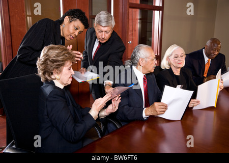 Multi-ethnic senior management meeting in boardroom Stock Photo