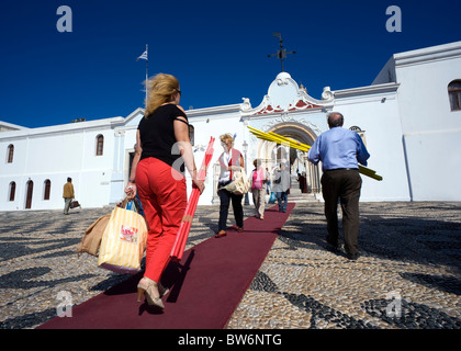 Pilgrims carrying candles congregate to the Church of Panagia Evangelistria in the town of Tinos, Greece. Stock Photo
