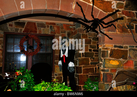 A haunted house decorated for Halloween with a ghoul and spider in Oklahoma, USA. Stock Photo