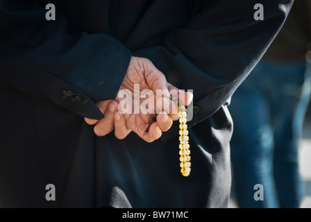 Man walking with a Rosary in his hands, Turkey, Asia Stock Photo