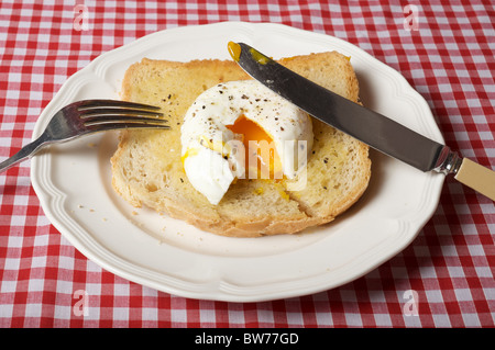 Poached egg on toast Stock Photo