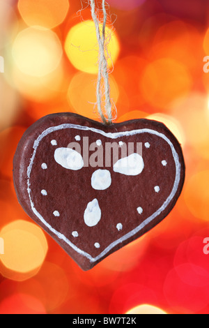 Gingerbread cookies heart decoration against blurred background Stock Photo