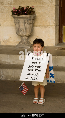 Child wears protest sign at Tea Party rally against federal bailouts and Pres. Obama's economic policies in San Antonio TX Stock Photo