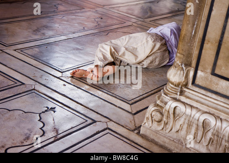 A sleeping Indian at Jama Masjid mosque, Delhi, India Stock Photo