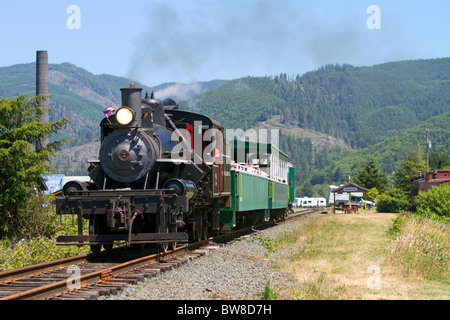 Tourists ride behind a 1910 Heisler Steam Locomotive at Garibaldi, Oregon, USA. Stock Photo