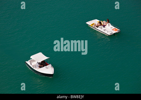 People ride pedalo boats on The Serpentine in Hyde Park ...