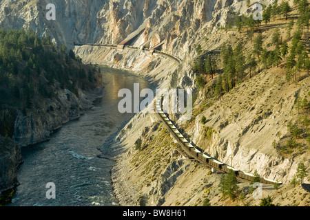 A train winds it's way through the Fraser Canyon north of Lytton, BC Canada. Stock Photo