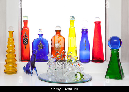 glass bottles on window ledge Stock Photo