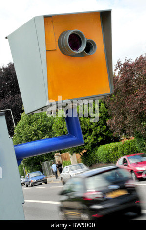 A Truvelo speed camera at the side of the road with blurred car passing Stock Photo