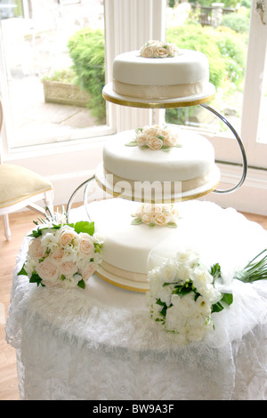 Wedding Cake and bouquets Stock Photo