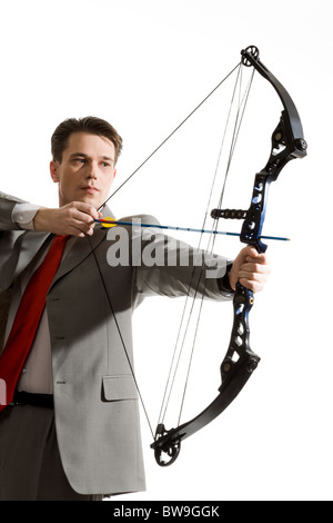 Portrait of businessman with crossbow isolated over white background Stock Photo
