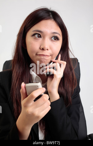 Office lady uses cellophane. Stock Photo