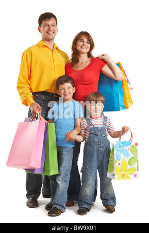 Photo of friendly parents and siblings with bags isolated over white background Stock Photo