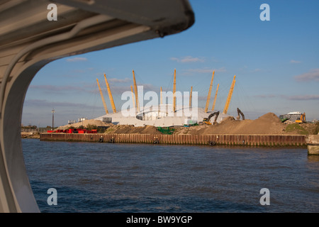 The O2 (formerly the Millenium Dome) in Greenwich, London, viewed from a passenger ferry on the River Thames. Stock Photo