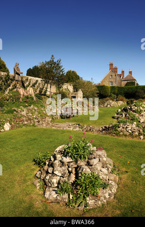 The ruins of Shaftesbury Abbey Dorset UK with a statue of King Alfred and the shrine which once housed the relics believed to be Stock Photo