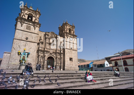 People on steps of Cathedral, Puno, Peru Stock Photo