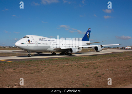 Commercial aviation. Hellenic Imperial Airways Boeing 747-200 taxiing on a taxiway at Malta International Airport shortly before departure Stock Photo