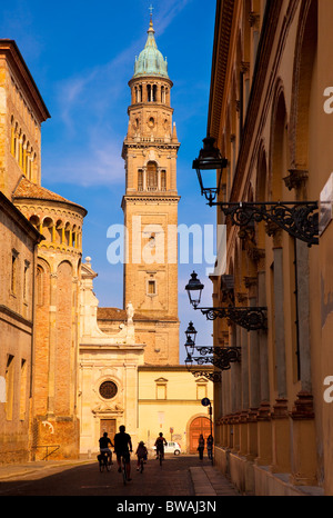Bicycling down Via Cardinal Ferrari with Chiesa San Giovanni Evangelista, Parma Emilia-Romagna Italy Stock Photo