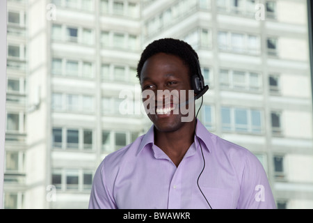 Businessman wearing phone headset Stock Photo